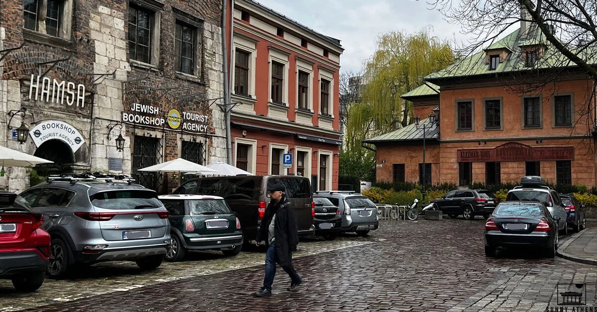 A man walking on Jewish Square