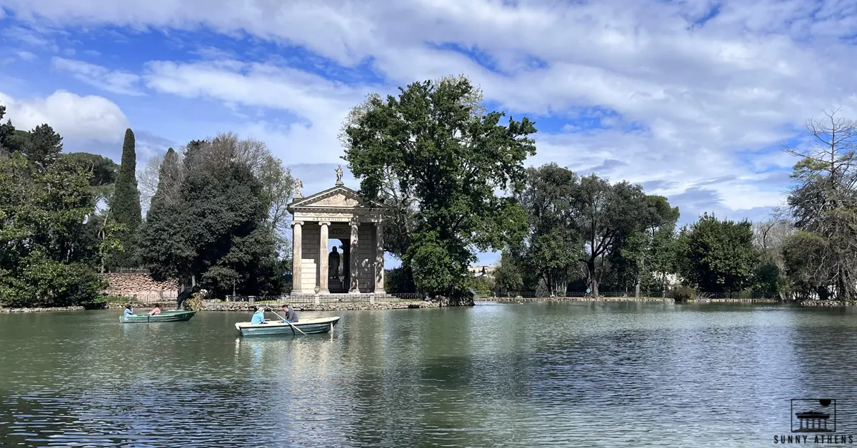 People rowing on the lake at Villa Borghese.