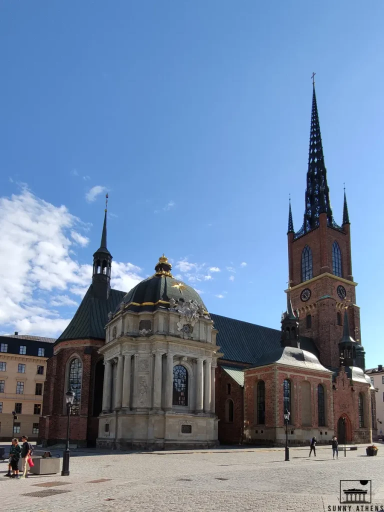 Stockholm Neighborhood Guide for First-Timers: The Riddarholmen Church against a clear blue sky in Stockholm.