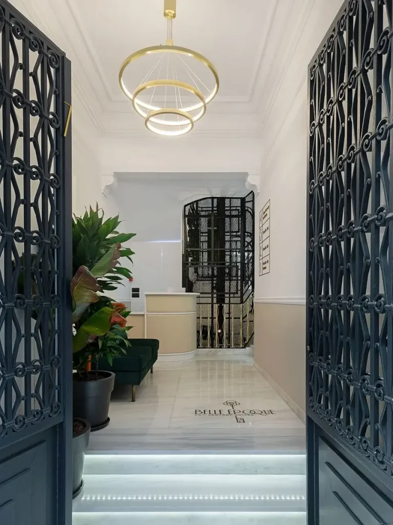 The entrance with the old elevator in Belle Epoque Suites in Athens