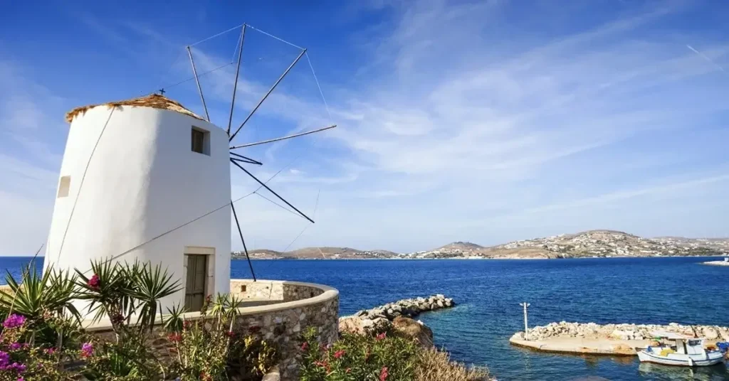 A windmill and the sea in Paros island in Greece.