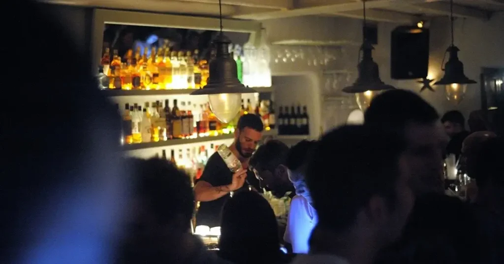 People drinking and dancing in Agosta bar in Paros Greece.