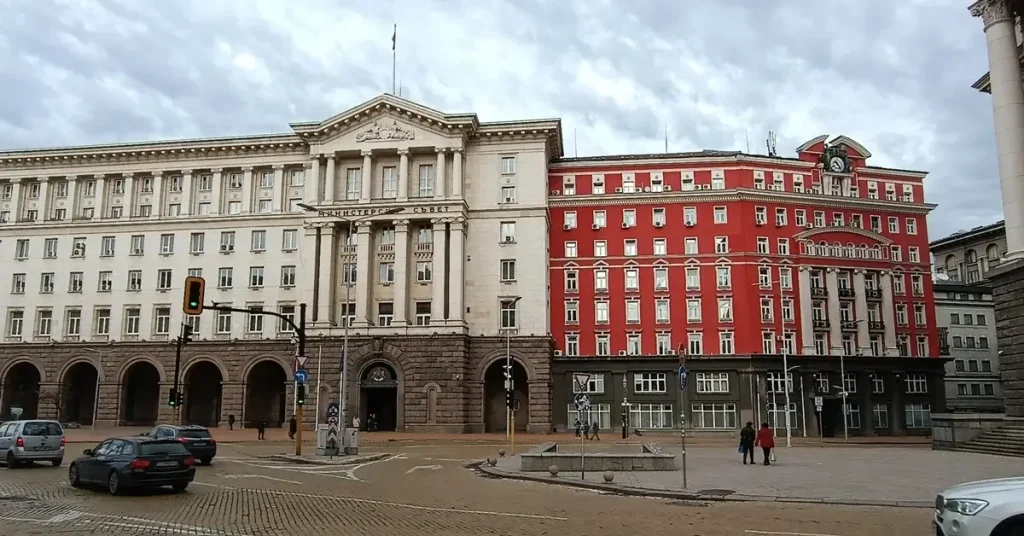 A striking red building in the center of Sofia, Bulgaria, capturing passengers attention.