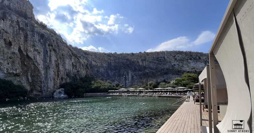 Athens Off-The-Beaten-Path Itinerary For Families: a serene view of Vouliagmeni Lake on a hot summer day.