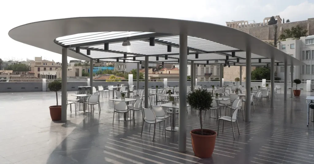 The spacious café terrace of the Acropolis Museum, offering a relaxing setting with views of the Acropolis.