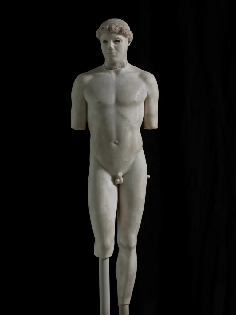 The Kritios Boy, a classical Greek marble statue on display at the Acropolis Museum.