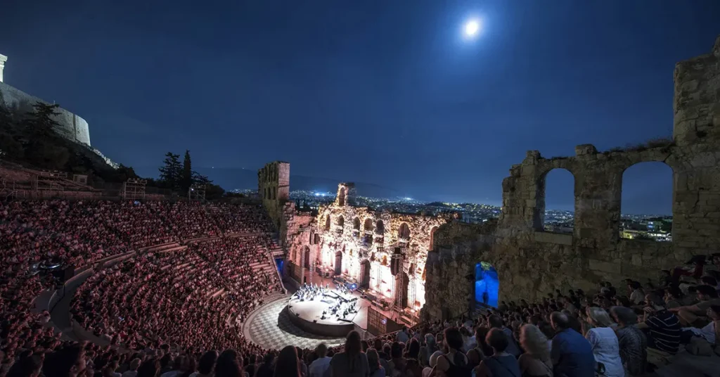 A nighttime event at the Odeon of Herodes Atticus, fully attended under a moonlit sky in 2024.