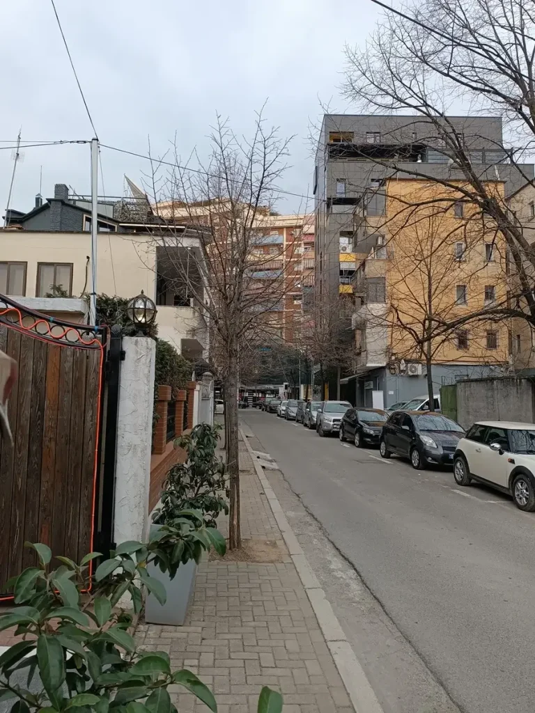 The old meets the new in a typical neighborhood of Tirana, Albania.