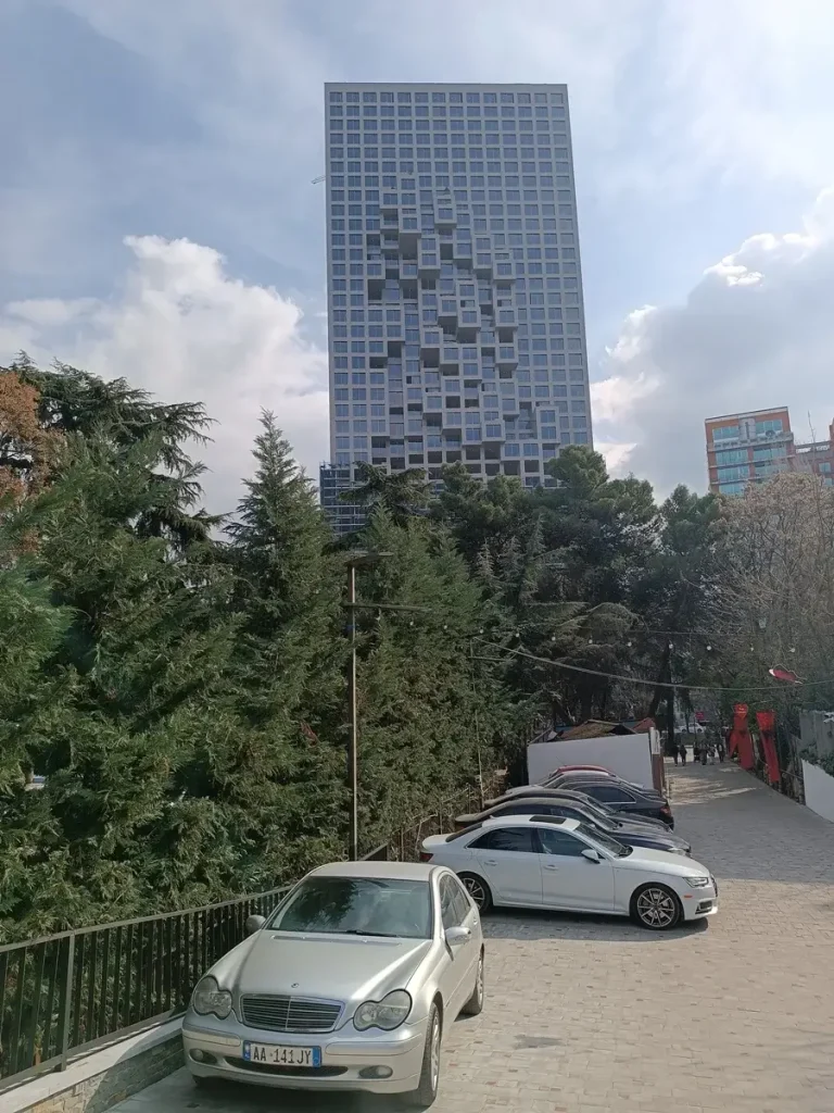 An architecturally impressive skyscraper in the city center of Tirana.