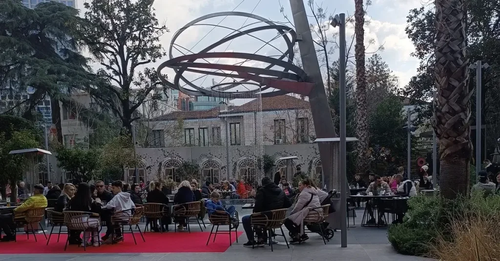 People enjoying their coffee at an outdoor café.