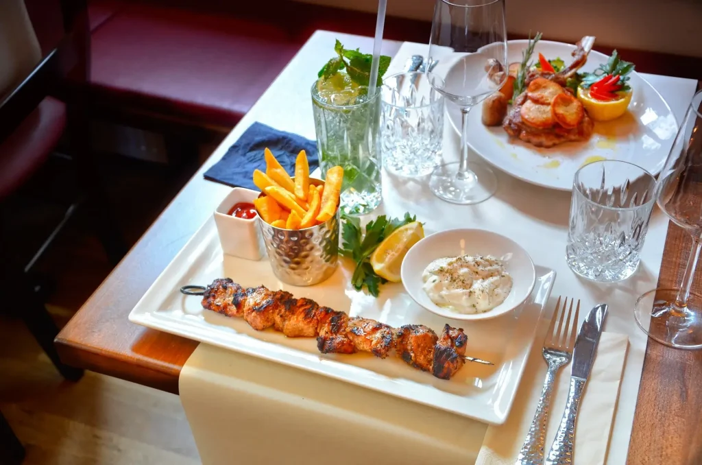 A traditional Greek chicken souvlaki plate in a restaurant in Plaka, Athens.