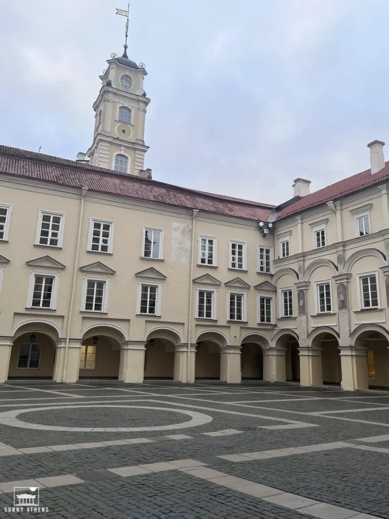 The picturesque courtyard of Vilnius University during a peaceful evening.