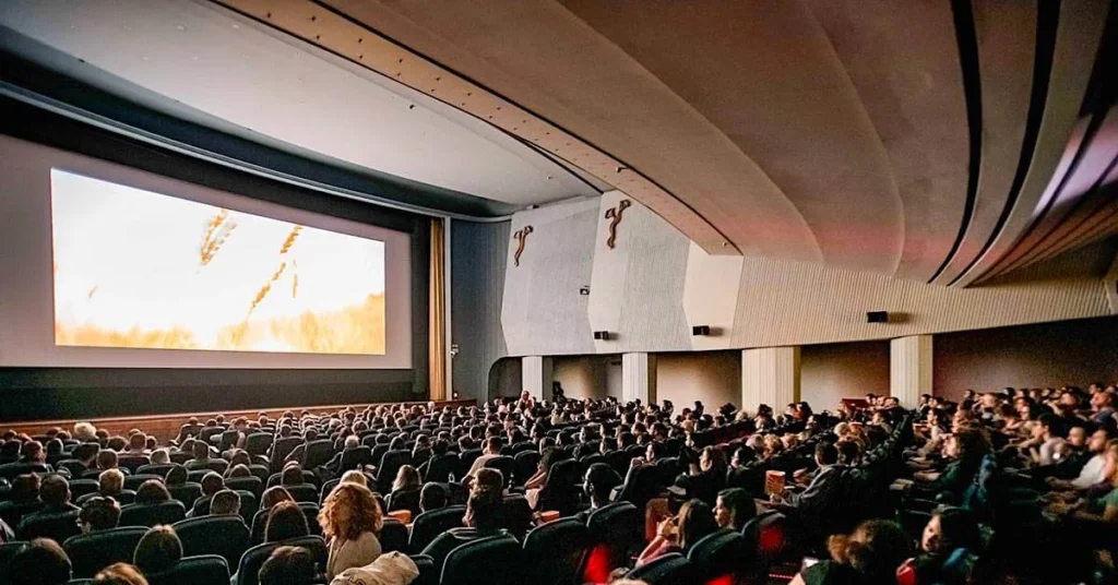 People watching a film in the large auditorium of movie theater Athinaion, one of the best indoor cinemas in Athens center