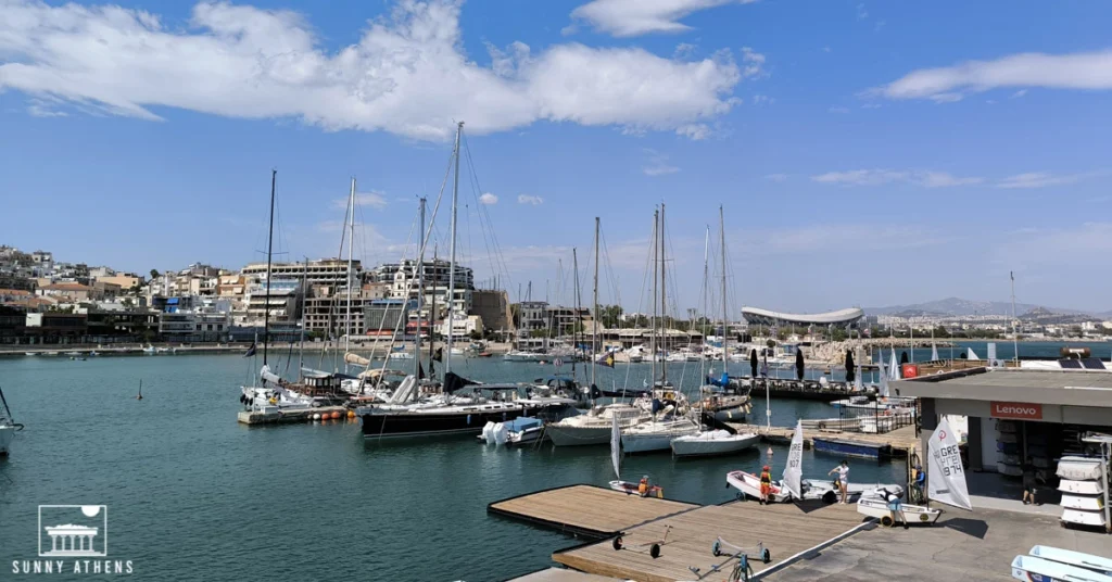 Sailboats docked at Mikrolimano marina in Piraeus on a sunny day.