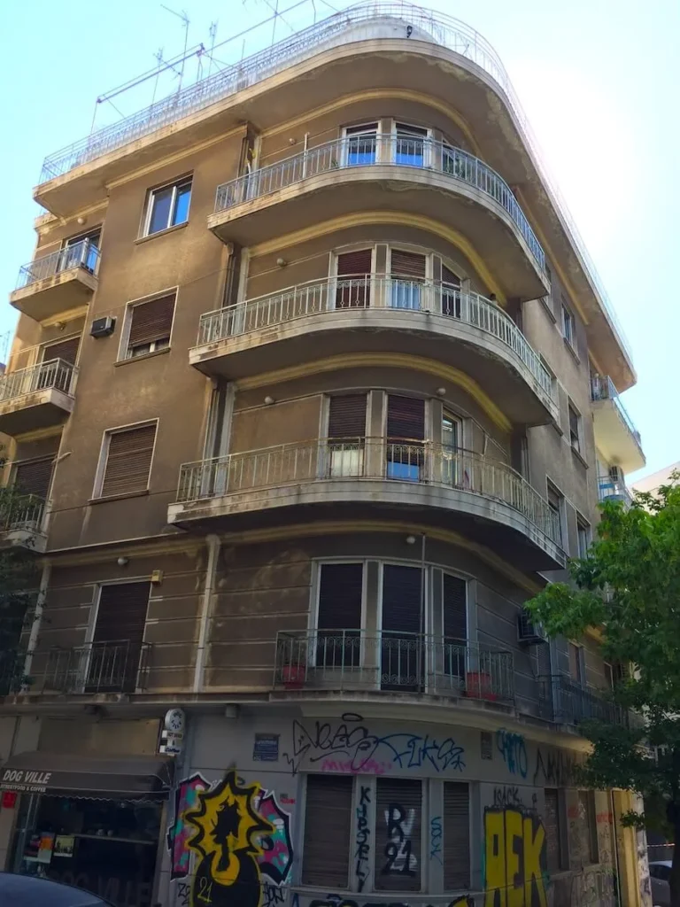 Kypseli Athens Travel Guide: View of an old apartment building in the corner of Fokionos Negri and Drosopoulou streets
