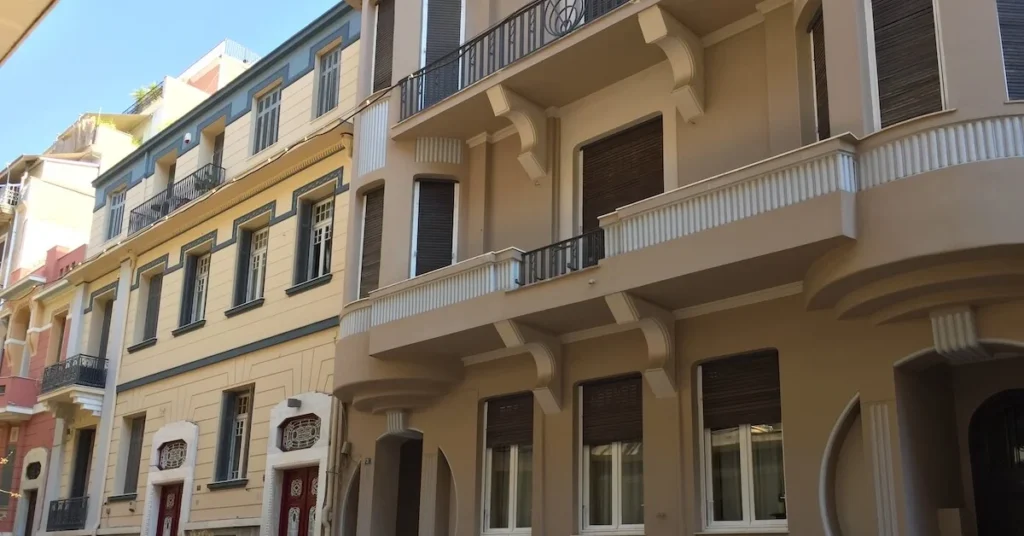 Kypseli Athens Travel Guide: View of three renovated mid-century buildings in Ithakis street in Kypseli
