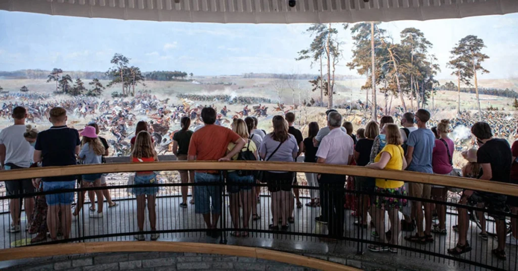 Visitors viewing the massive circular painting of the Battle of Raclawice.