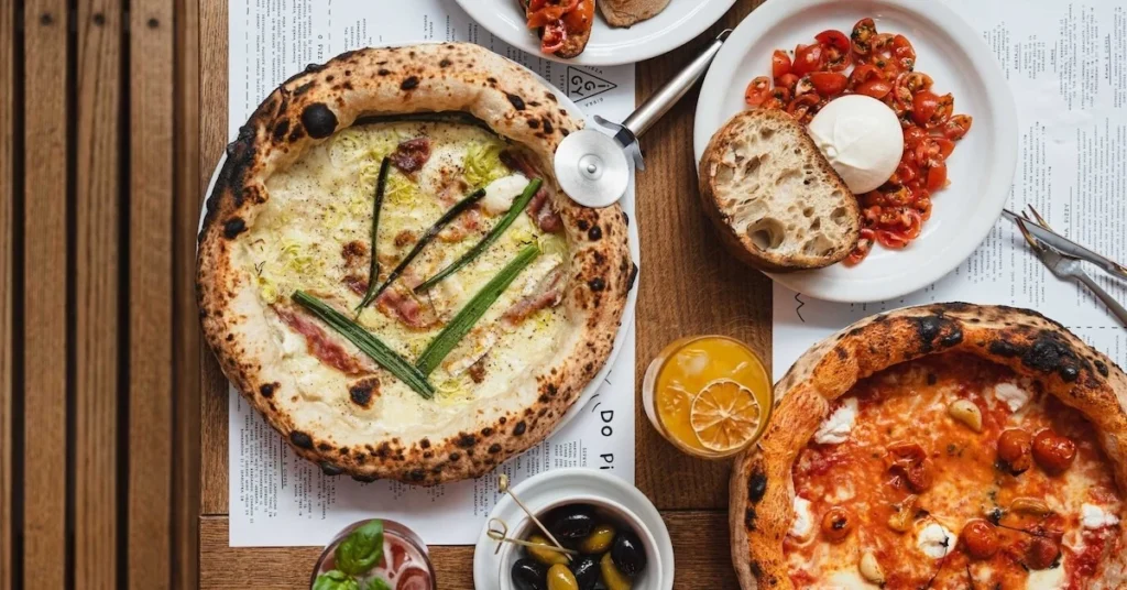 Wood-fired pizzas, bruschetta, and drinks served at Iggy Pizza.