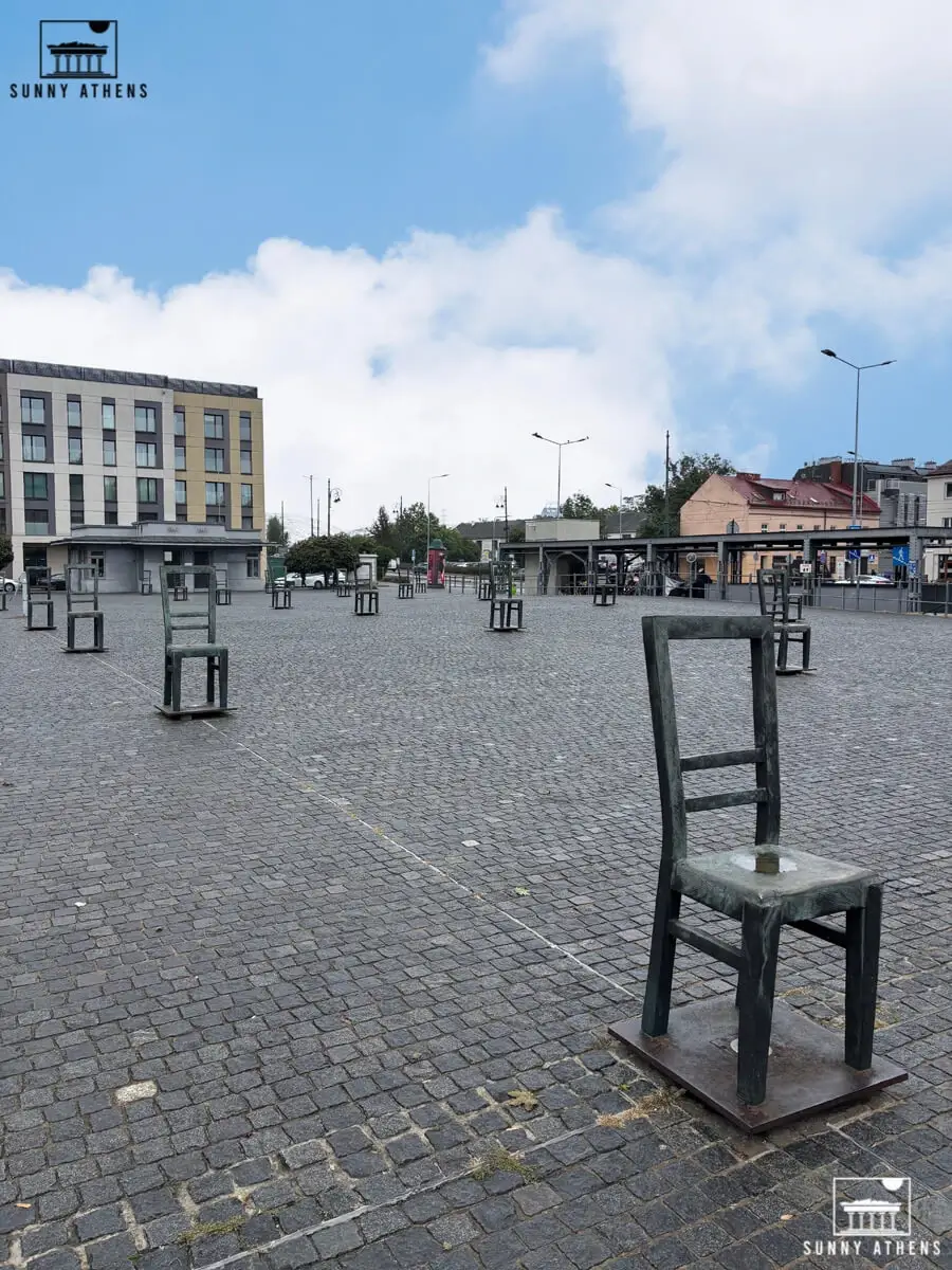 The memorial of empty bronze chairs at Ghetto Heroes Square.