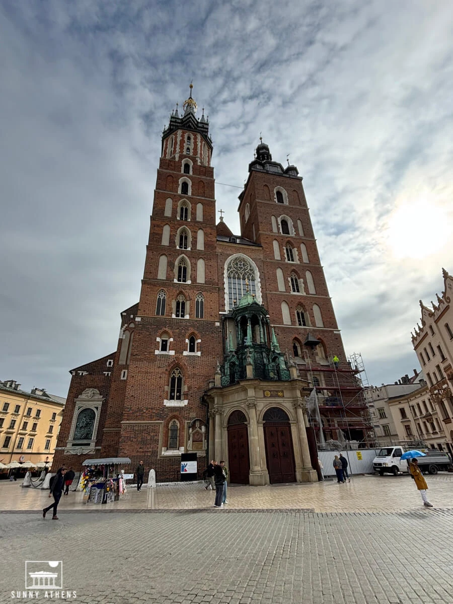 The Gothic twin towers of St. Mary's Basilica, made of red brick.