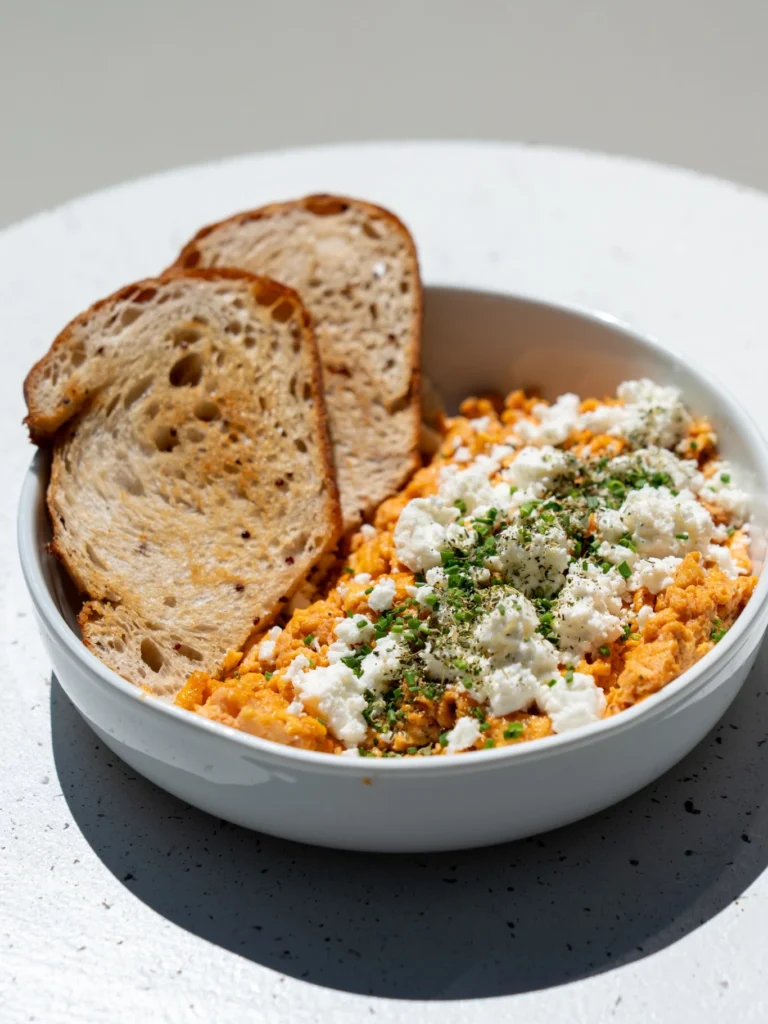 a serving of the traditional dish, Kagianas with two slices of bread