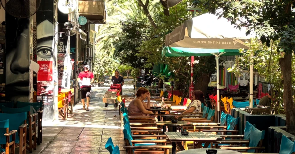 outdoor cafe in Exarchia neighborhood with colourful chairs