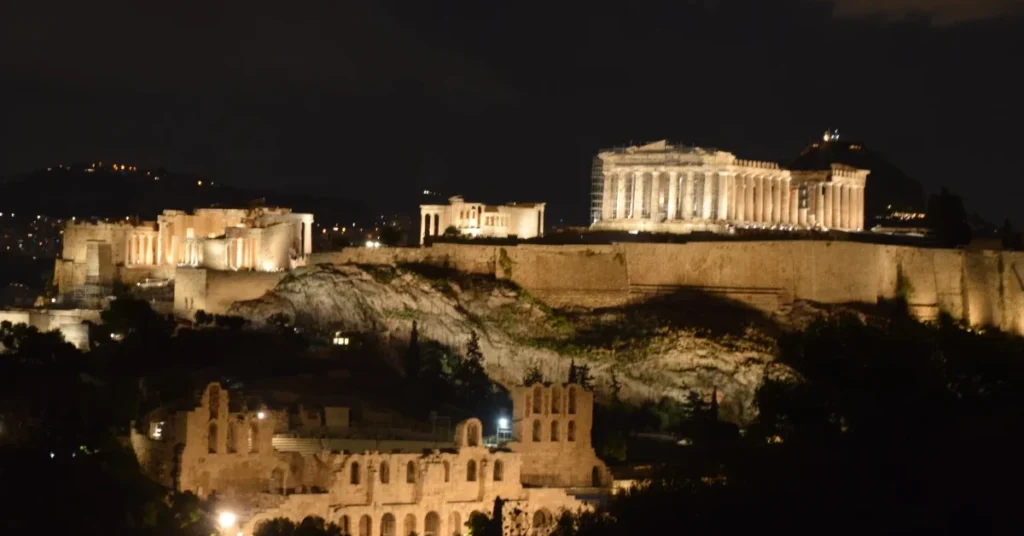 A view at night where the Acropolis and Herodeion are visible