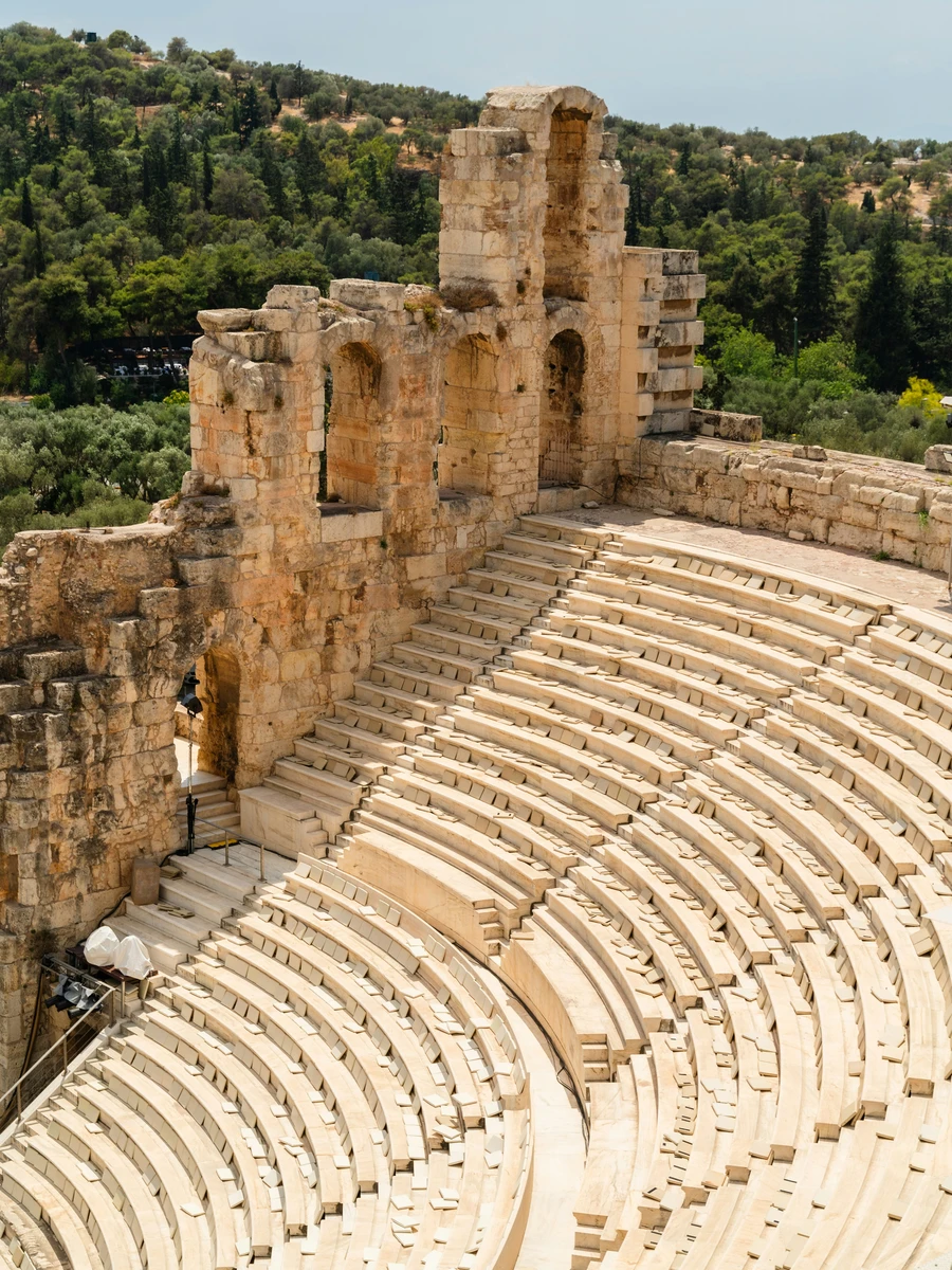 Ancient stone arches and marble seating rows of the Odeon of Herodes Atticus theatre in Athens