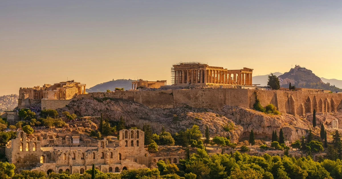 Panoramic view of the Parthenon bathed in golden sunset light