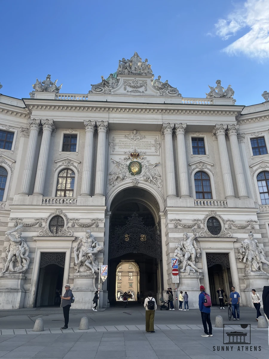 The curved facade of the Michaelertrakt entrance at the Hofburg Palace in Vienna
