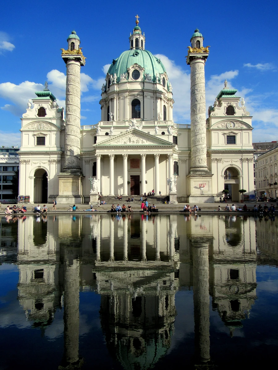 Saint Charles Church Karlskirche and its reflection in the pond on Karlsplatz in Vienna