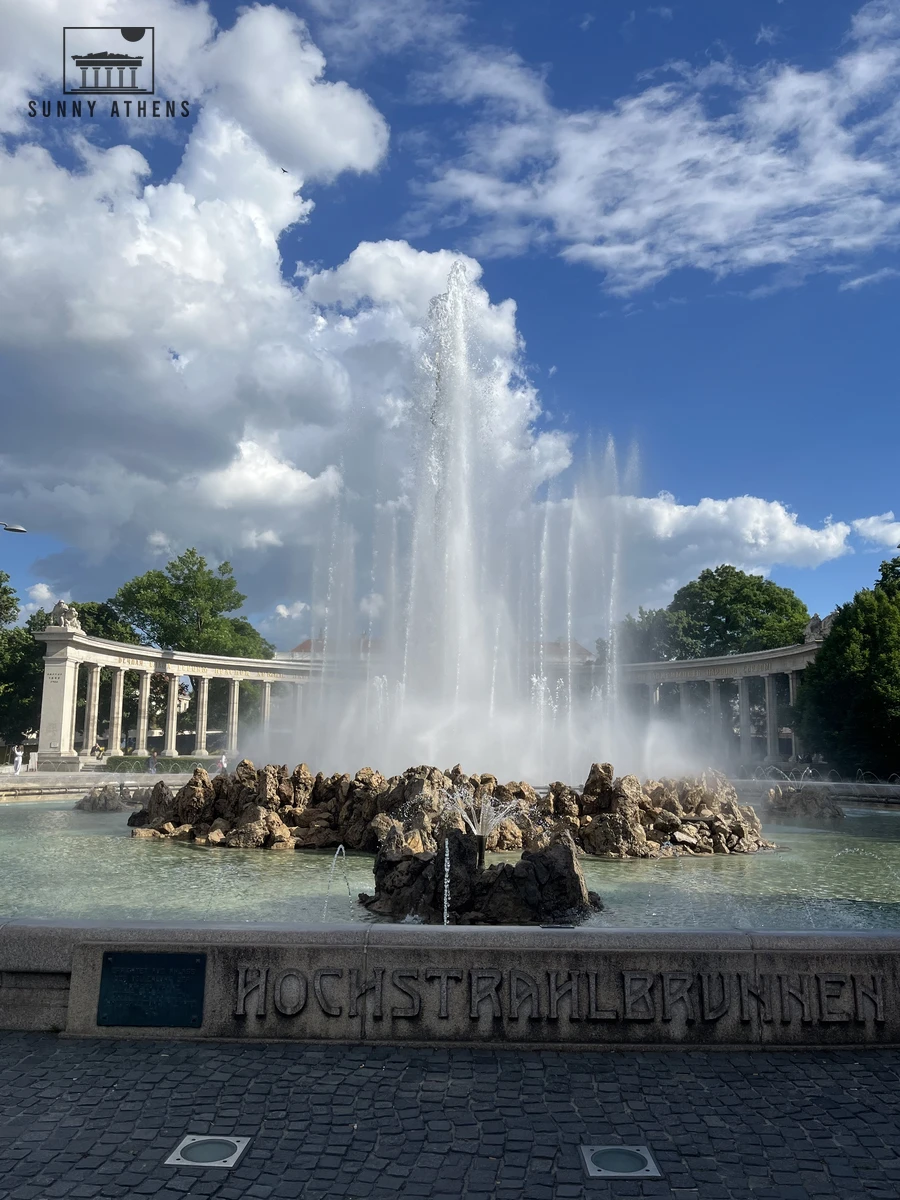 The large Hochstrahlbrunnen fountain spraying water at Schwarzenbergplatz in Vienna