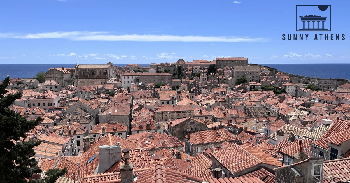 Panoramic view across the sea of red terracotta rooftops and stone buildings of Dubrovnik Old Town seen from the City Walls