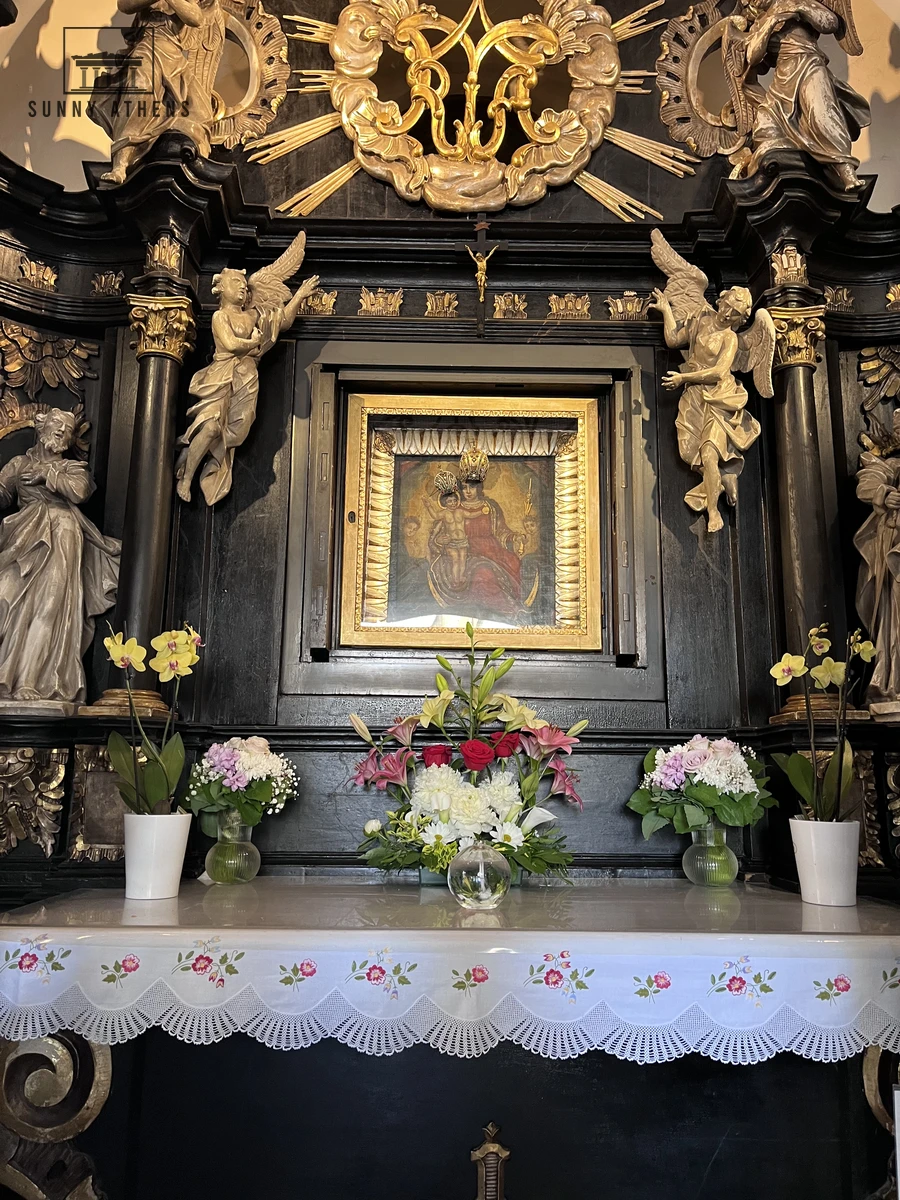 Gilded Baroque altar with the 18th-century painting of the Virgin Mary inside the Stone Gate shrine