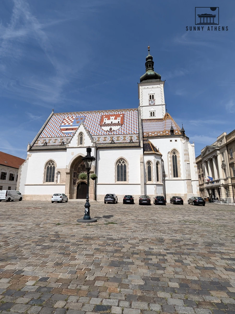 St. Mark's Church with its distinctive 1880 checkered tile roof showing historic Croatian coats of arms