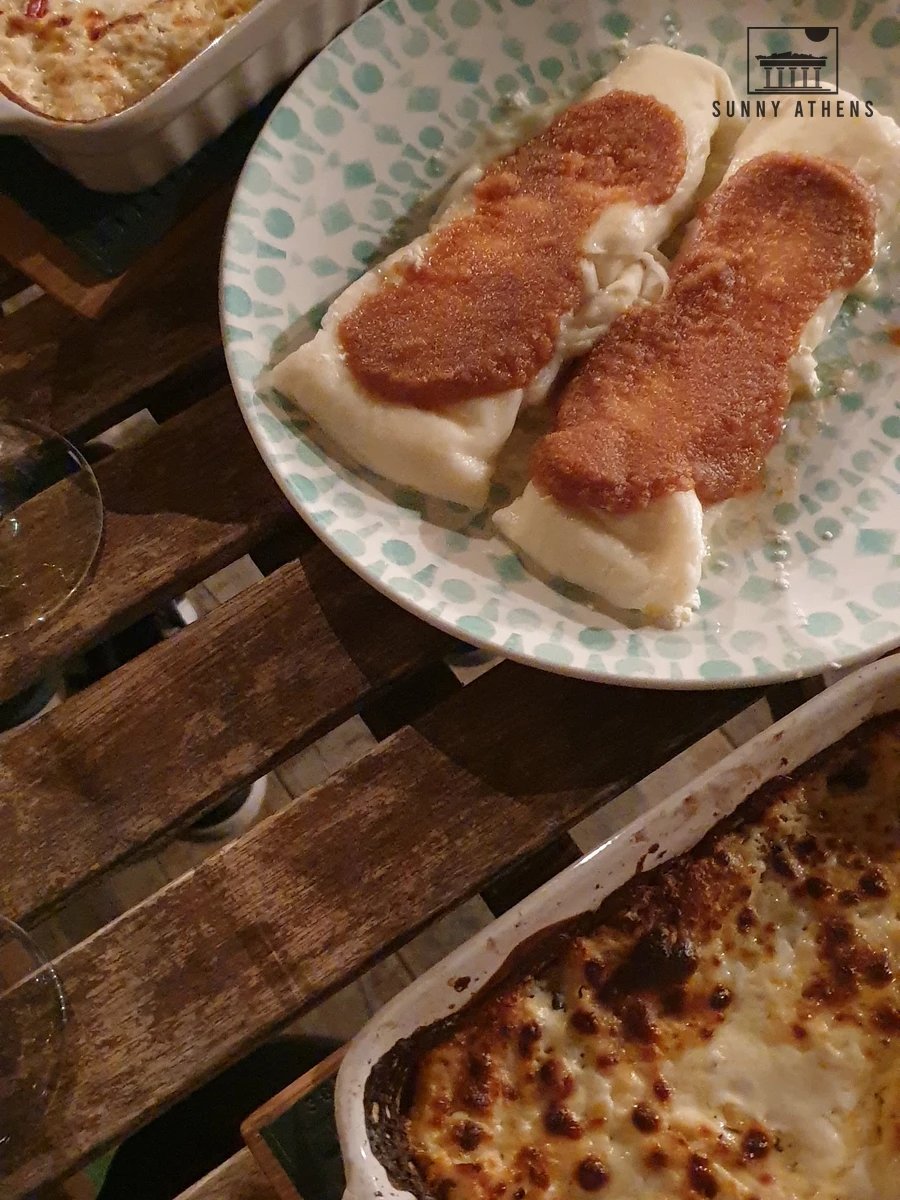 Ceramic baking dishes of traditional baked cottage cheese strukli and boiled strukli with toasted breadcrumbs