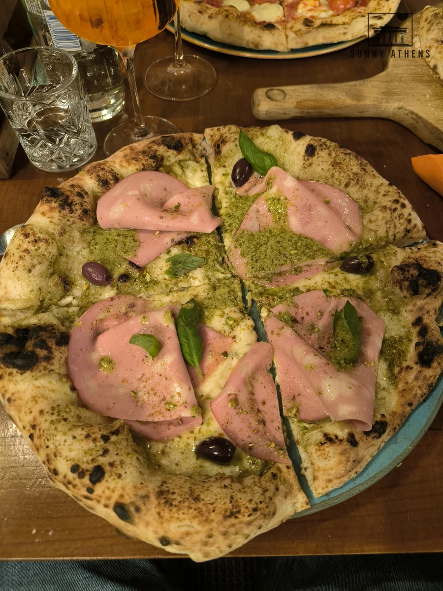 Neapolitan pizza topped with mortadella and pistachio pesto at Basta Gourmet Bar in Zagreb