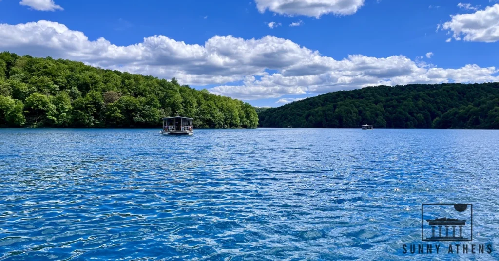 Electric passenger boat crossing the blue water of Lake Kozjak in Plitvice Lakes National Park