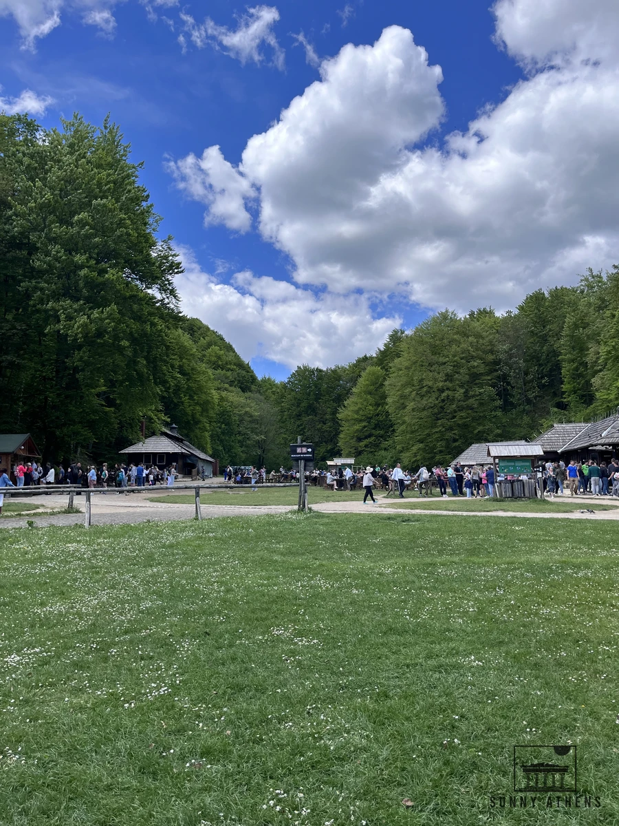 Picnic meadow and wooden huts at the Lake Kozjak boat dock