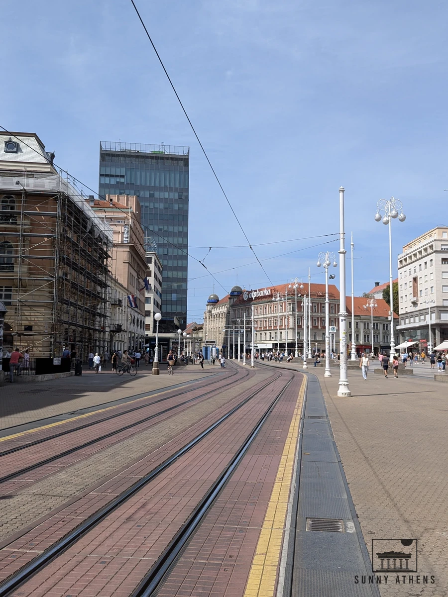 Pedestrian Ilica Street with a blue city tram passing by 19th-century buildings